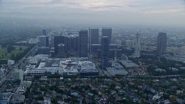 7.6K aerial stock footage passing by a shopping mall set against office buildings, sunrise, Century City, California Aerial Stock Footage | AX0156_133E