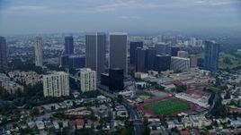 7.6K aerial stock footage of condominiums and skyscrapers near Beverly Hills High School, sunrise, Century City, California Aerial Stock Footage | AX0156_136E
