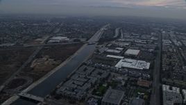 7.6K aerial stock footage flying alongside the Los Angeles river canal, sunrise, Marina Del Rey, California Aerial Stock Footage | AX0156_178