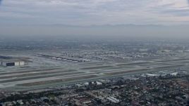 7.6K aerial stock footage of LAX at sunrise on a cloudy day, Los Angeles, California Aerial Stock Footage | AX0156_188