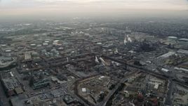 7.6K aerial stock footage of an oil refinery in El Segundo, California, sunrise Aerial Stock Footage | AX0156_195E
