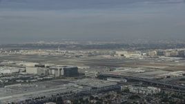 7.6K aerial stock footage approaching LAX on a cloudy day, Los Angeles, California Aerial Stock Footage | AX0157_002E