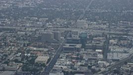 7.6K aerial stock footage passing by office buildings and freeways, haze, Santa Monica, California Aerial Stock Footage | AX0157_012