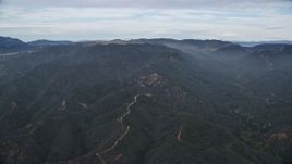 7.6K aerial stock footage approach the Santa Monica Mountains with marine layer in California Aerial Stock Footage | AX0157_014