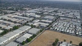 7.6K aerial stock footage of mobile homes and warehouse buildings in Chatsworth, California Aerial Stock Footage | AX0157_056E