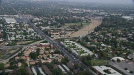 7.6K aerial stock footage flying over suburban homes and apartment buildings in Northridge, California Aerial Stock Footage | AX0157_070