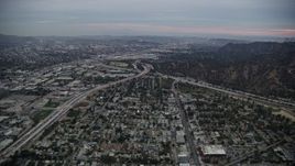 7.6K aerial stock footage flying towards the I-5 & 134 interchange at twilight, Glendale, California Aerial Stock Footage | AX0158_003