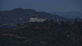7.6K aerial stock footage tracking Griffith Observatory and reveal Hollywood Sign, twilight, Los Angeles, California Aerial Stock Footage | AX0158_007E