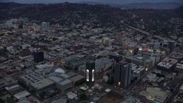 7.6K aerial stock footage of businesses and office buildings along Sunset Boulevard at twilight, Hollywood, California Aerial Stock Footage | AX0158_017