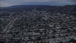 7.6K aerial stock footage following Sunset Boulevard toward Sunset Strip, twilight, West Hollywood, California Aerial Stock Footage | AX0158_019E