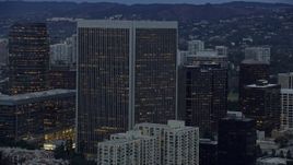 7.6K aerial stock footage passing by Century Plaza Towers, twilight, Century City, California Aerial Stock Footage | AX0158_028