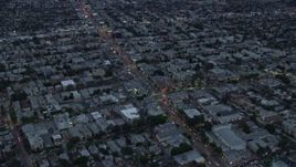 7.6K aerial stock footage flying over businesses and neighborhoods along La Cienega Boulevard and West Pico Blvd, twilight, Central Los Angeles, California Aerial Stock Footage | AX0158_037E