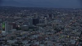 7.6K aerial stock footage of office buildings along Wilshire Boulevard, twilight, Koreatown, Los Angeles, California Aerial Stock Footage | AX0158_041E