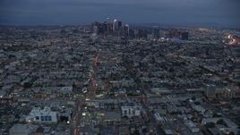 7.6K aerial stock footage of Downtown Los Angeles skyline from urban neighborhoods, California, twilight Aerial Stock Footage | AX0158_043