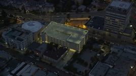7.6K aerial stock footage of a reverse view of the Angelus Temple and a parking garage at twilight in Echo Park, Los Angeles, California Aerial Stock Footage | AX0158_055