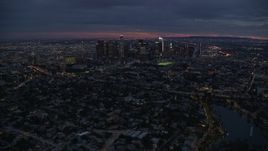 7.6K aerial stock footage flying over 101 freeway at twilight to approach Downtown Los Angeles, California Aerial Stock Footage | AX0158_056E