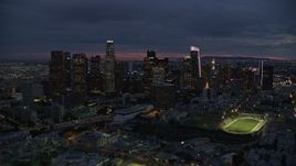 7.6K aerial stock footage flying between skyscrapers at twilight through Downtown Los Angeles, California Aerial Stock Footage | AX0158_058E