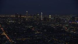 7.6K aerial stock footage of a slow approach to the tall towers of Downtown Los Angeles, California at night Aerial Stock Footage | AX0158_072E