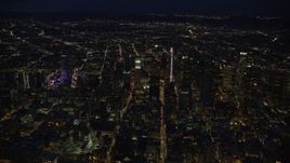 7.6K aerial stock footage of a wide view of skyscrapers at night in Downtown Los Angeles, California Aerial Stock Footage | AX0158_080E