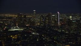 7.6K aerial stock footage flying by skyscrapers at nighttime in Downtown Los Angeles, California Aerial Stock Footage | AX0158_087E