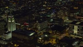 7.6K aerial stock footage of City Hall, LAPD Headquarters, LA Times building at night, Downtown Los Angeles, California Aerial Stock Footage | AX0158_098