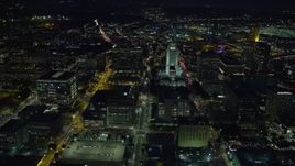 7.6K aerial stock footage of a reverse view of Los Angeles City Hall at night in Downtown Los Angeles, California Aerial Stock Footage | AX0158_105