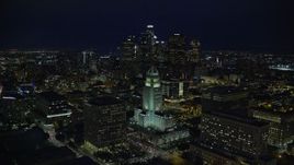 7.6K aerial stock footage of Downtown skyscrapers seen while flying by City Hall at night in Downtown Los Angeles, California Aerial Stock Footage | AX0158_109E