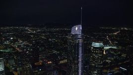 7.6K aerial stock footage orbiting Wilshire Grand Center at night in Downtown Los Angeles, California Aerial Stock Footage | AX0158_112