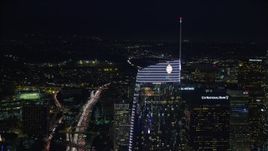 7.6K aerial stock footage orbiting of the Wilshire Grand Center tower at night in Downtown Los Angeles, California Aerial Stock Footage | AX0158_113E