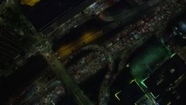 7.6K aerial stock footage of a bird's eye view of heavy nighttime traffic on the 110 Freeway, Downtown Los Angeles, California Aerial Stock Footage | AX0158_124