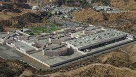 7.6K aerial stock footage orbiting a supermax correctional facility, Valencia, California Aerial Stock Footage | AX0159_042