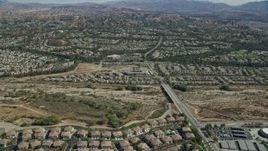 7.6K aerial stock footage flying over tract homes, Valencia, California Aerial Stock Footage | AX0159_046E