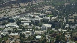 7.6K aerial stock footage of a reverse shot of scientific facility buildings, JPL, Pasadena, Caliofrnia Aerial Stock Footage | AX0159_076E
