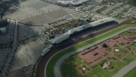 7.6K aerial stock footage flying by and away from Santa Anita Park horse race track in Arcadia, California Aerial Stock Footage | AX0159_118
