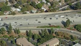 7.6K aerial stock footage orbiting traffic stopped by CHP on the 210 Freeway in Arcadia, CA Aerial Stock Footage | AX0159_119