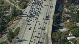 7.6K aerial stock footage of a reverse view of traffic stopped by CHP on 210 Freeway in Arcadia, California Aerial Stock Footage | AX0159_120E