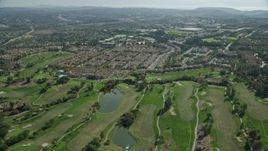 7.6K aerial stock footage flying over golf course and tract homes, Aliso Viejo, California Aerial Stock Footage | AX0159_177E