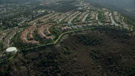 7.6K aerial stock footage flying by hillside homes in Laguna Niguel, California Aerial Stock Footage | AX0159_182E