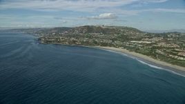 7.6K aerial stock footage flying by homes around Three Arch Bay Beach in Laguna Beach, California Aerial Stock Footage | AX0159_201E
