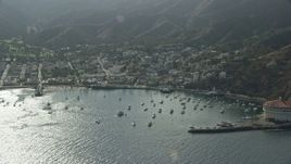 7.6K aerial stock footage flying away from the small island town of Avalon, Santa Catalina Island, California Aerial Stock Footage | AX0159_264E