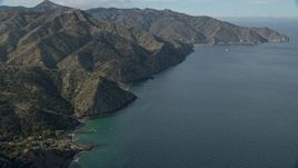 7.6K aerial stock footage following the rugged coastline of Santa Catalina Island, California toward a campground Aerial Stock Footage | AX0159_266E