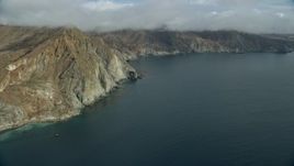 7.6K aerial stock footage of steep cliffs on the coast of Santa Catalina Island, California Aerial Stock Footage | AX0160_015