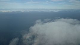 7.6K aerial stock footage flying over low level clouds over the Pacific Ocean off the coast of Southern California Aerial Stock Footage | AX0160_022E