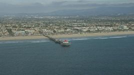 7.6K aerial stock footage of an Huntington Beach Pier and beach in Huntington Beach, California Aerial Stock Footage | AX0160_039