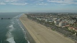 7.6K aerial stock footage of Huntington Beach Pier and Hyatt Regency in Huntington Beach, California Aerial Stock Footage | AX0160_040