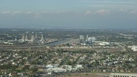 7.6K aerial stock footage of LADWP Haynes Generating Station behind residential neighborhoods in Long Beach, California Aerial Stock Footage | AX0160_054