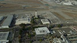 7.6K aerial stock footage approaching the control tower and runways at Long Beach Airport, California Aerial Stock Footage | AX0160_066