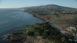 7.6K aerial stock footage of Point Fermin Lighthouse and homes atop coastal cliffs in San Pedro, California Aerial Stock Footage | AX0161_016