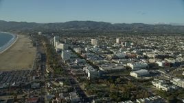 7.6K aerial stock footage flying over the beach to approach shops and Santa Monica Place mall in Santa Monica, California Aerial Stock Footage | AX0161_069E