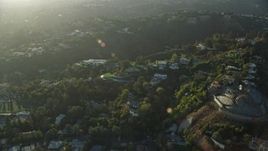 7.6K aerial stock footage of a reverse view of hillside mansions in Beverly Glen, Los Angeles, California Aerial Stock Footage | AX0161_102